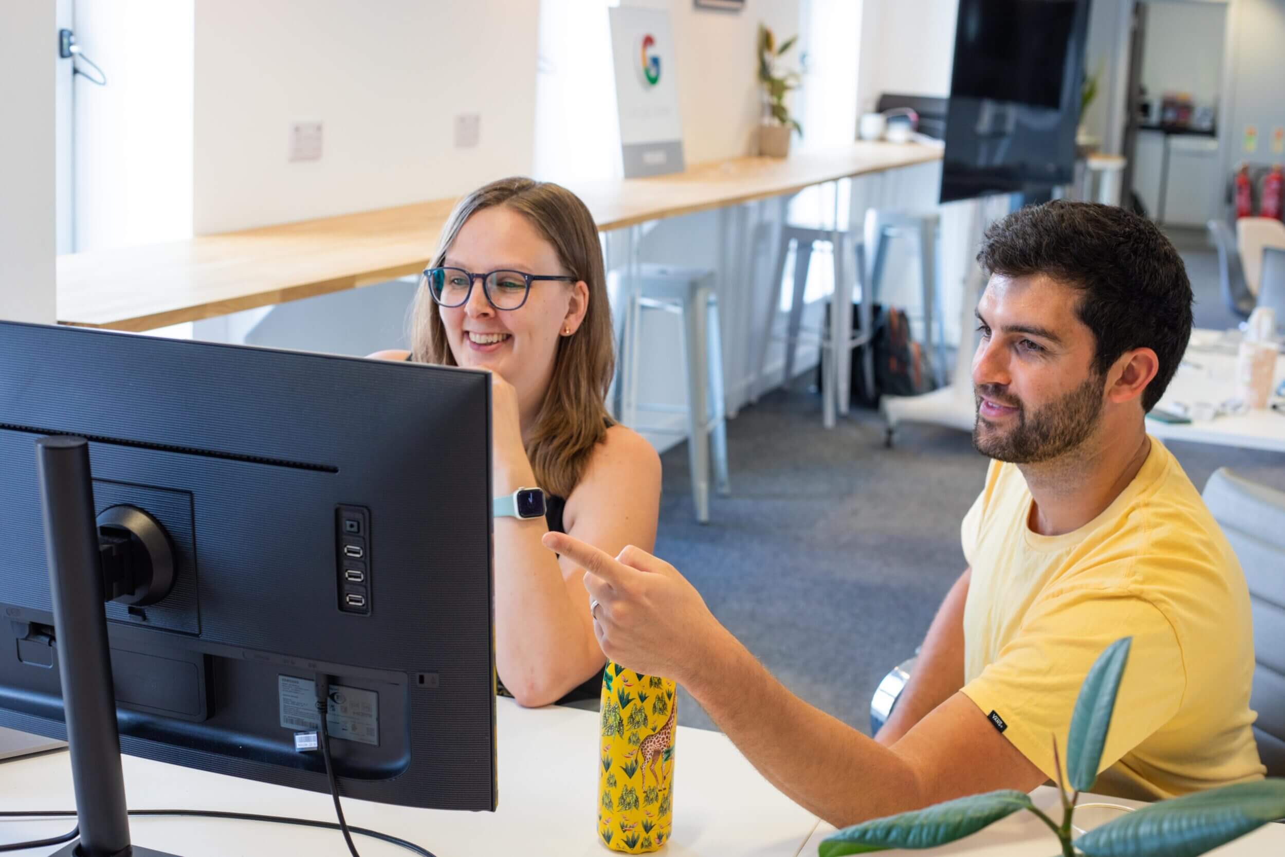An image of two of Uplift's website design team.